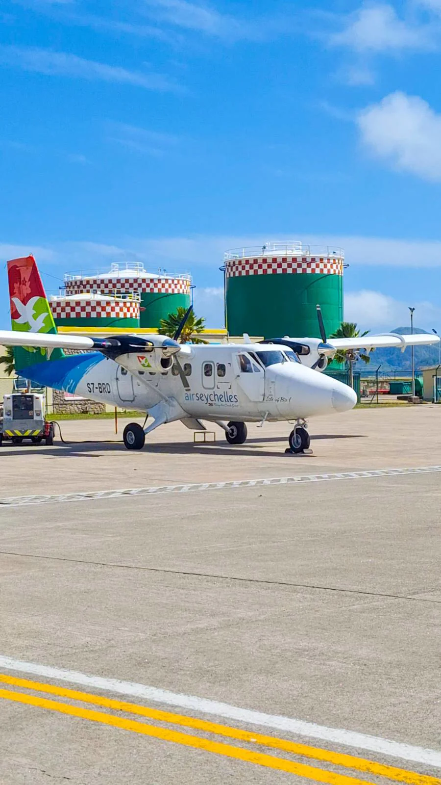 An Air Seychelles domestic plane at the tiny Praslin island airport - island hopping logistics.