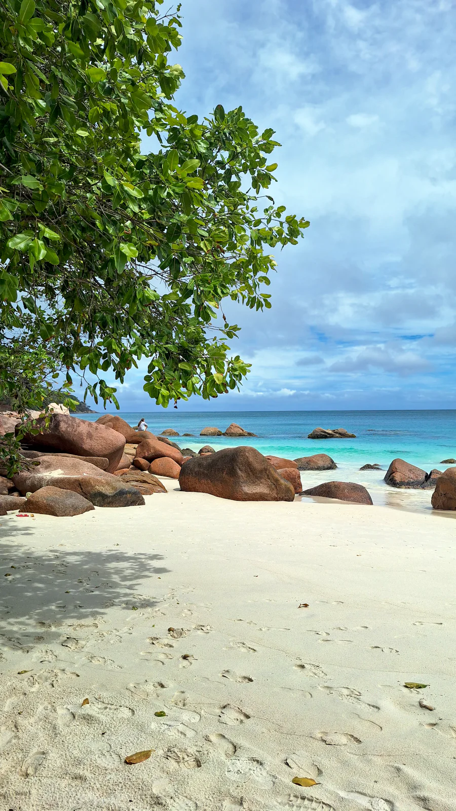 Crystal-clear turquoise water and massive granite rocks at Anse Source d'Argent in La Digue.