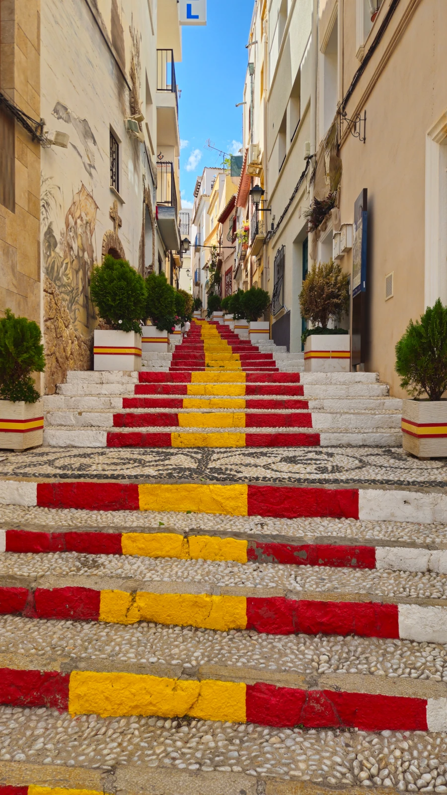 The famous Spanish Flag Steps on Carrer de Puchalt in the historic center of Calp, Spain.