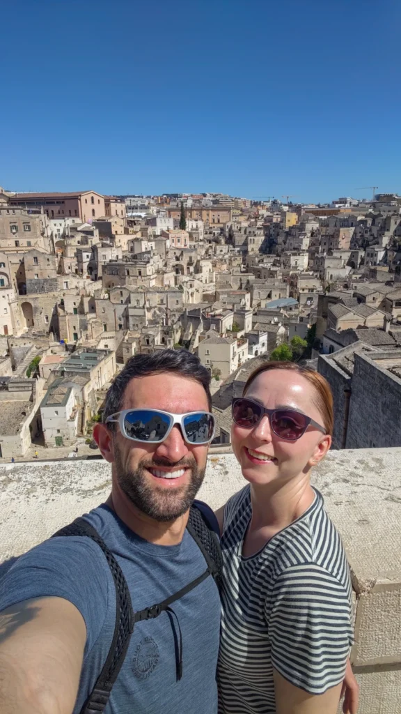 Joanna and Adam - Smart Travel Experts, founders of Millennials Do Travel, at Belvedere Luigi Guerricchio viewpoint in Matera.