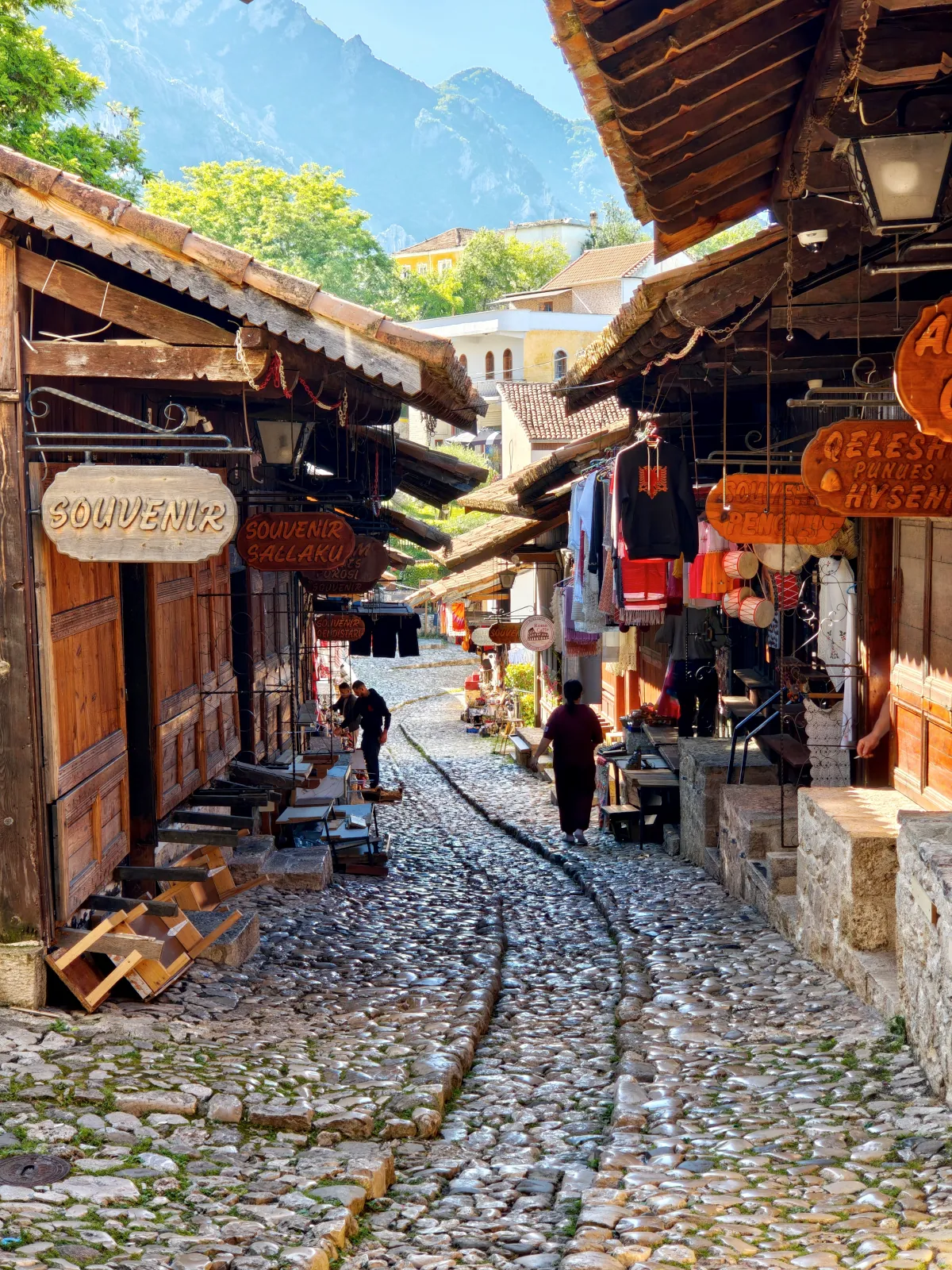 Traditional souvenir stalls and wooden shops along the historic Old Bazaar in Krujë, Albania.