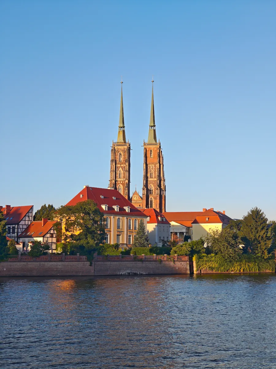 View of the Odra River, Archbishop's Palace, and twin towers of the Cathedral of St. John the Baptist in Ostrów Tumski, Wrocław.